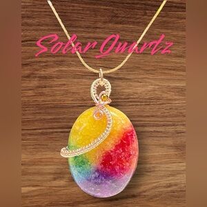 Colorful solar quartz oval in silver and pink and silver